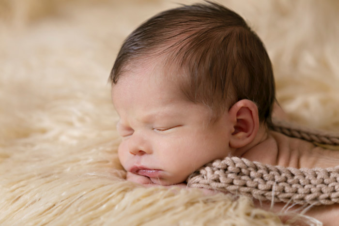Layer your props but make sure you protect your most valuable items for better newborn photography
