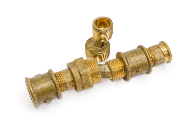 Brass eccentric connectors and other plumbing components. Brass eccentric connectors, pipe couplings and other threaded plumbing components on a white background royalty free stock photos