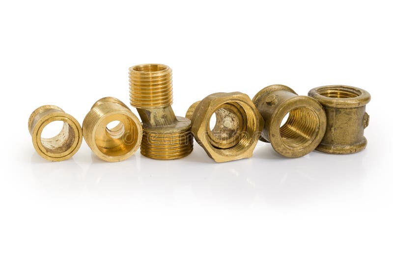 Brass eccentric connectors and other plumbing components on whit. Brass eccentric connectors, pipe couplings and other plumbing components on a white background stock photos