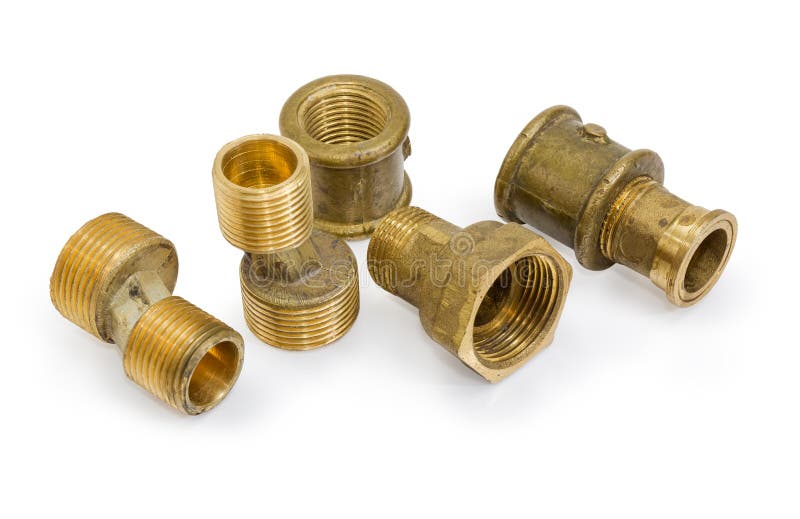 Different brass pipe fittings and plumbing components on white b. Brass eccentric connectors, pipe couplings and other plumbing components on a white background stock photography