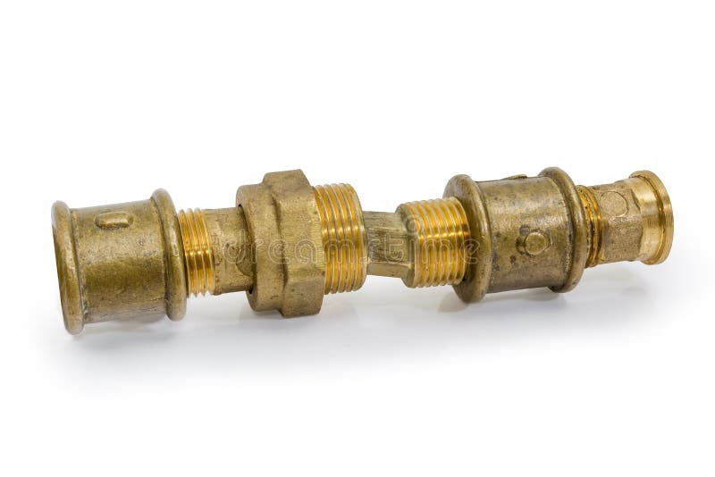 Different brass threaded plumbing components connected together. Brass eccentric connector, pipe couplings and other threaded plumbing components connected royalty free stock photo